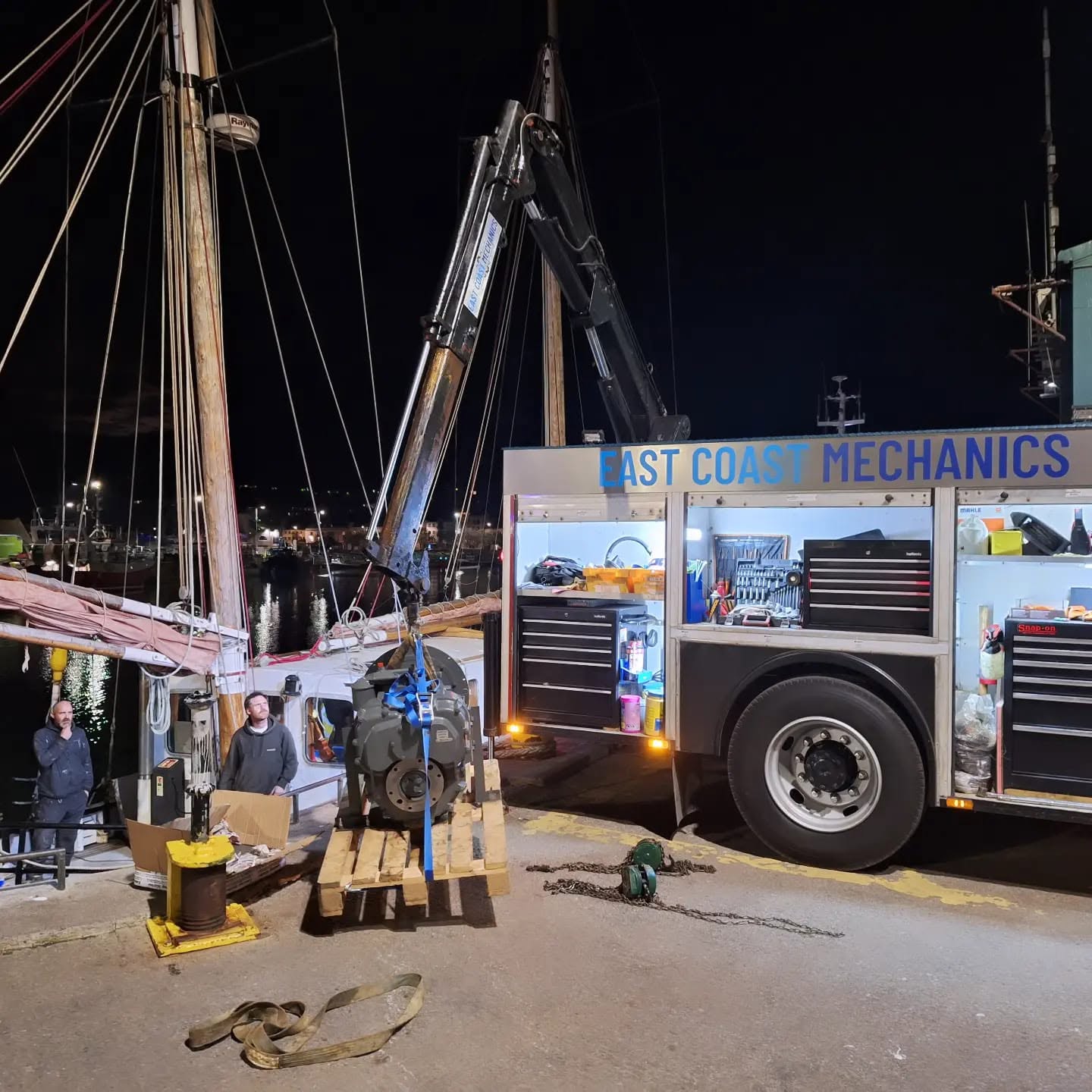 Crane recovery truck extended at night in Ireland