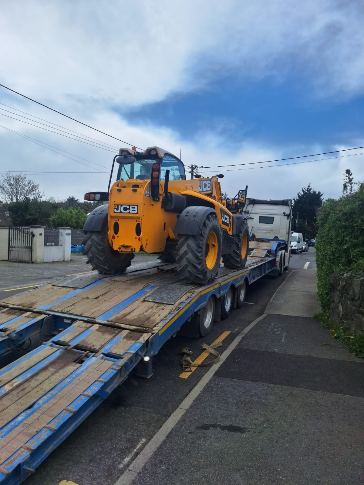 Machinery recovery truck transporting heavy plant in Ireland