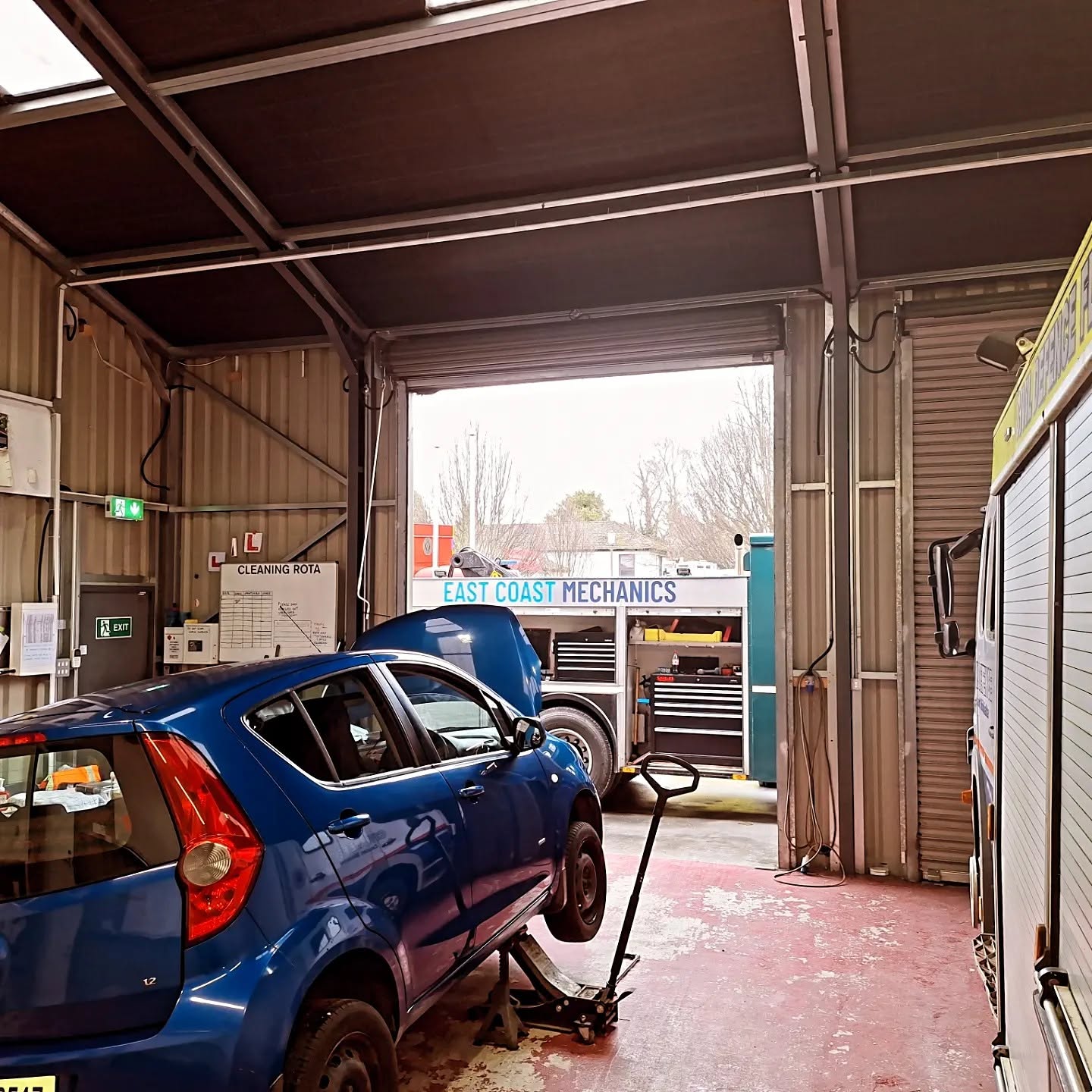 Mobile mechanic running diagnostics on a vehicle on-site in Ireland